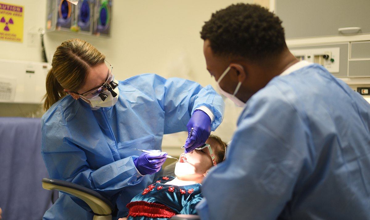 College of Dentistry students work with a patient to improve their skills and knowledge