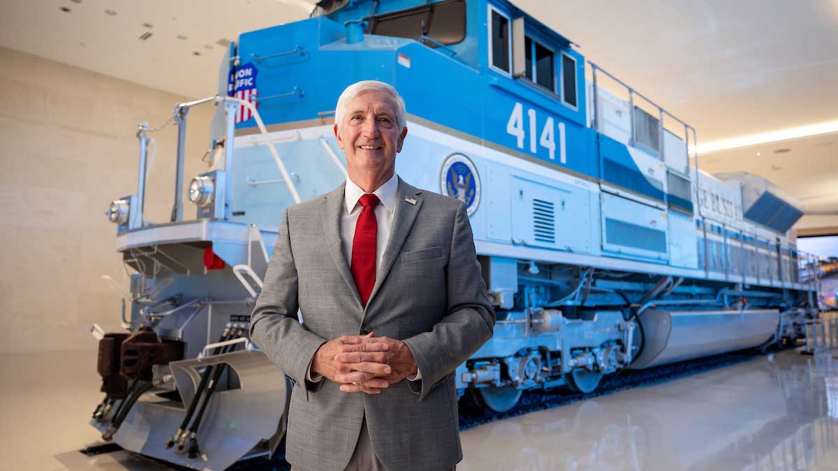 Andrew Card in front of the Union Pacific 4141 locomotive